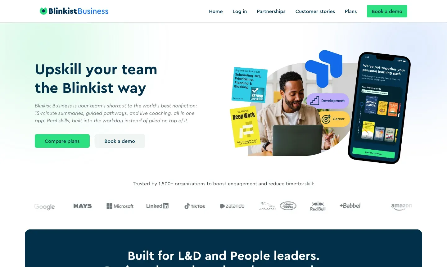 The Blinkist Business homepage: "Upskill your team the Blinkist way" above a row of client logos.